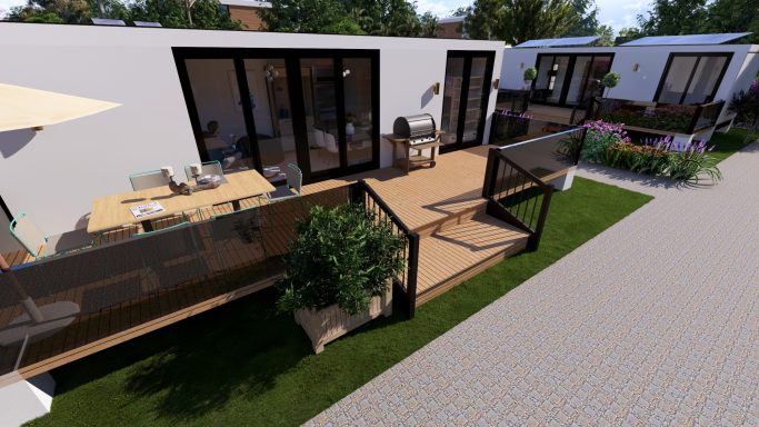 Moderne Ferienhäuser mit Terrassen und Gärten in einer grünen Umgebung.