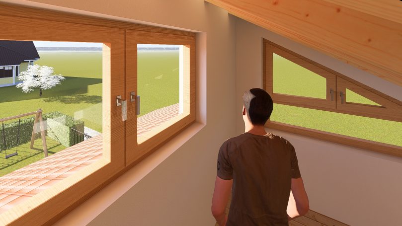 Person steht am Fenster und schaut auf den Garten und eine Wiese draußen.