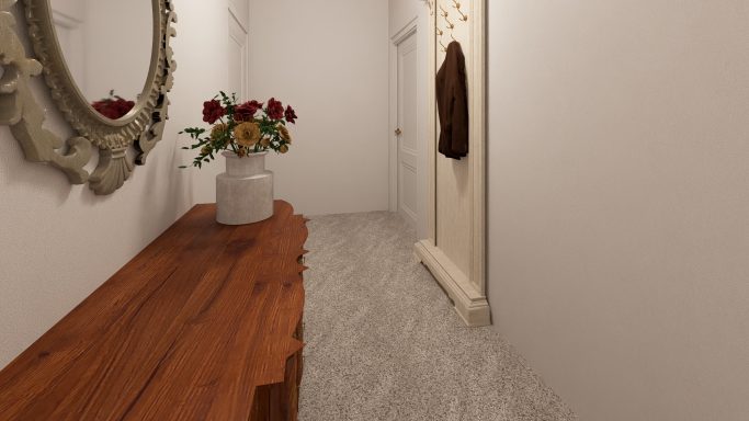 Heller Flur mit Holztisch, Spiegel, Blumenstrauß und braunem Kleidungsstück an der Wand.
