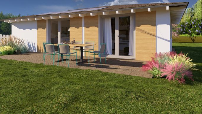 Modern Holzhaus mit Terrasse und Garten, umgeben von bunten Pflanzen.