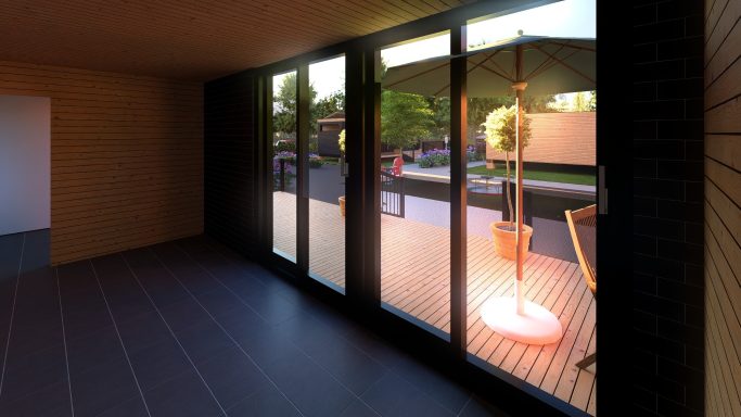 Heller Innenraum mit großen Fenstern und Blick auf eine Terrasse mit Sonnenschirm.