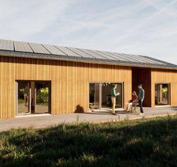 Terrassenansicht des barrierefreien Bungalows Eleonore mit großzügiger Fensterfront, rollstuhlgerechter Gestaltung und möglicher Betreuerwoh