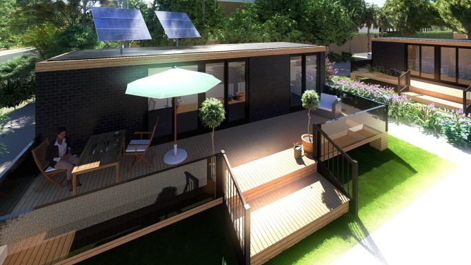 Moderne, nachhaltige Wohnhäuser mit Solarpanels und Gartenmöbeln im Freien.