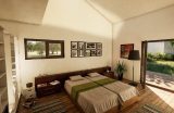 Schlafzimmer im Bungalow Eleonore mit barrierefreiem Zugang zur Terrasse, bodentiefen Fenstern und natürlicher Lichtführung – umgesetzt von