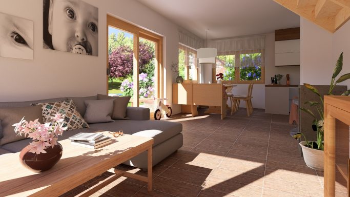 Helle, moderne Wohnküche mit Sofa, Tisch und großen Fenstern, Blick auf einen Garten.