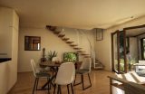 Innenansicht der Betreuerwohnung im Bungalow Eleonore mit Galerie-Treppe, Essbereich und großen Fensterflächen in nachhaltiger Holzbauweise
